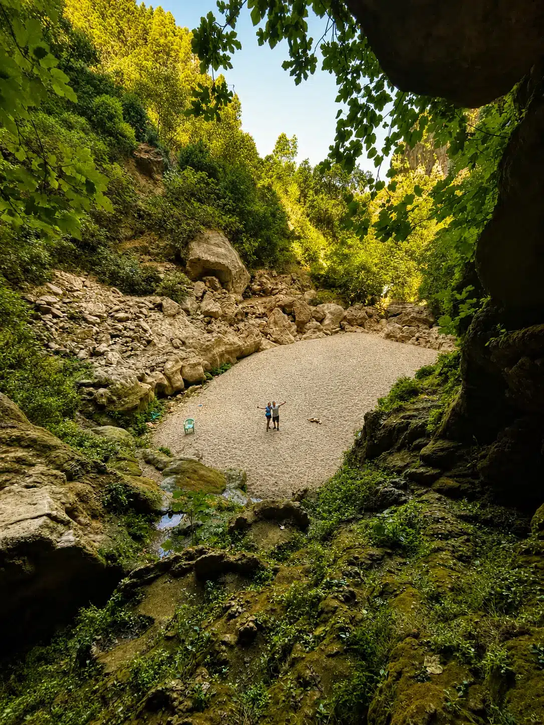 Rocky riverbed surrounded by green forest in Akchour near Chefchaouen